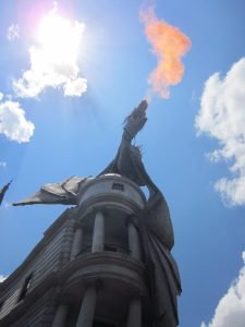 Dragon breathing fire atop Grigott's bank