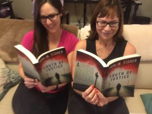 Readers Tyrette Tebbi and her mother Dr. Joyce Metzendorf reading South of Justice.