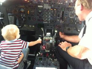 boy in cockpit of commercial jet