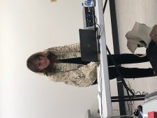 Author Joni M. Fisher connects her laptop to the overhead projector.